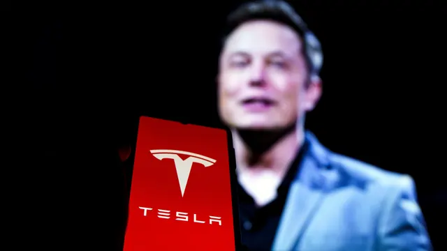 Tesla's Profit Drops 43% as Musk Starts Building Robots and Plans to Sell Driverless Cabs