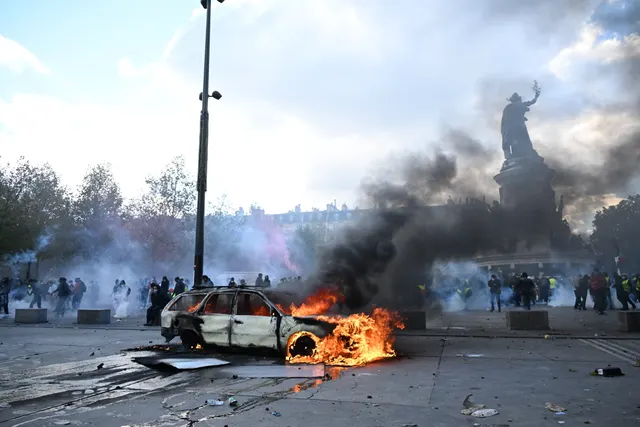 Scuffles and fires break out as protesters rally across France, joining students
